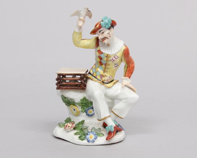 Harlequin with a bird