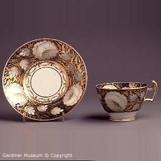 Teacup and saucer with flowers on a blue ground