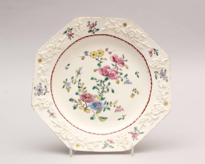 Plate with moulded prunus pattern